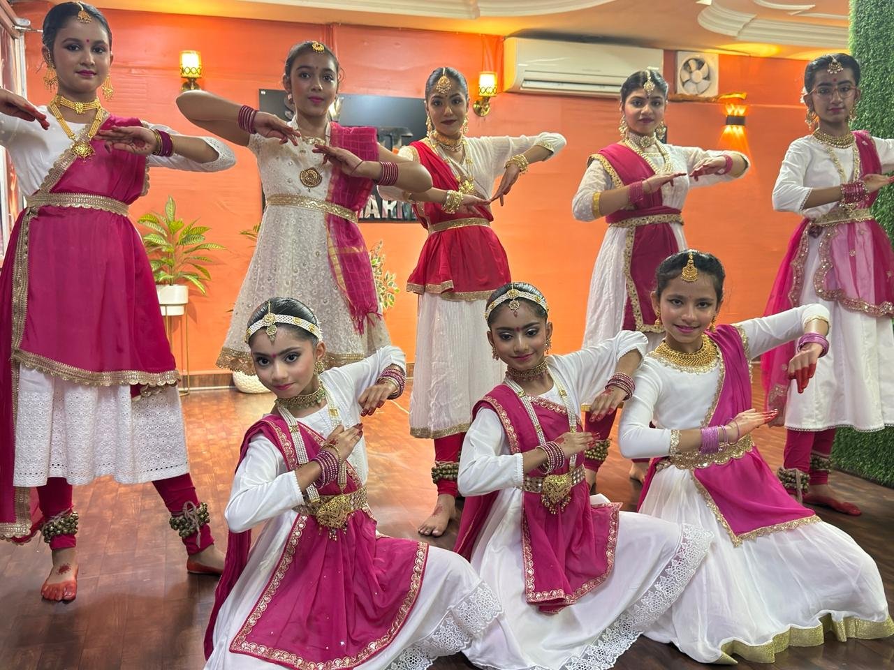 Shiv Nritya Kendra students in Kathak costume, posed together after a performance